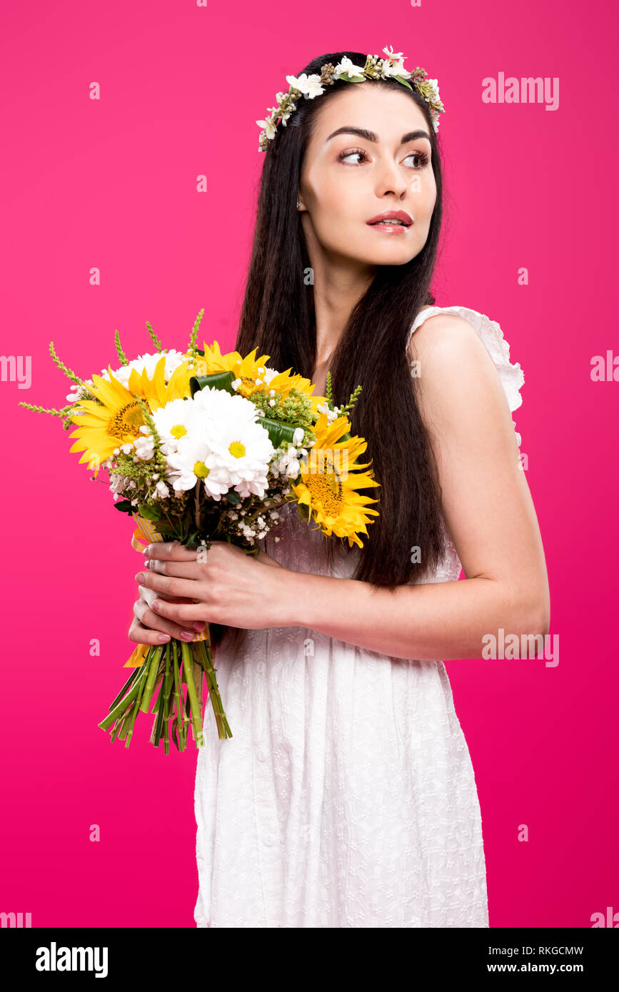 beautiful brunette woman in white dress and floral wreath holding ...