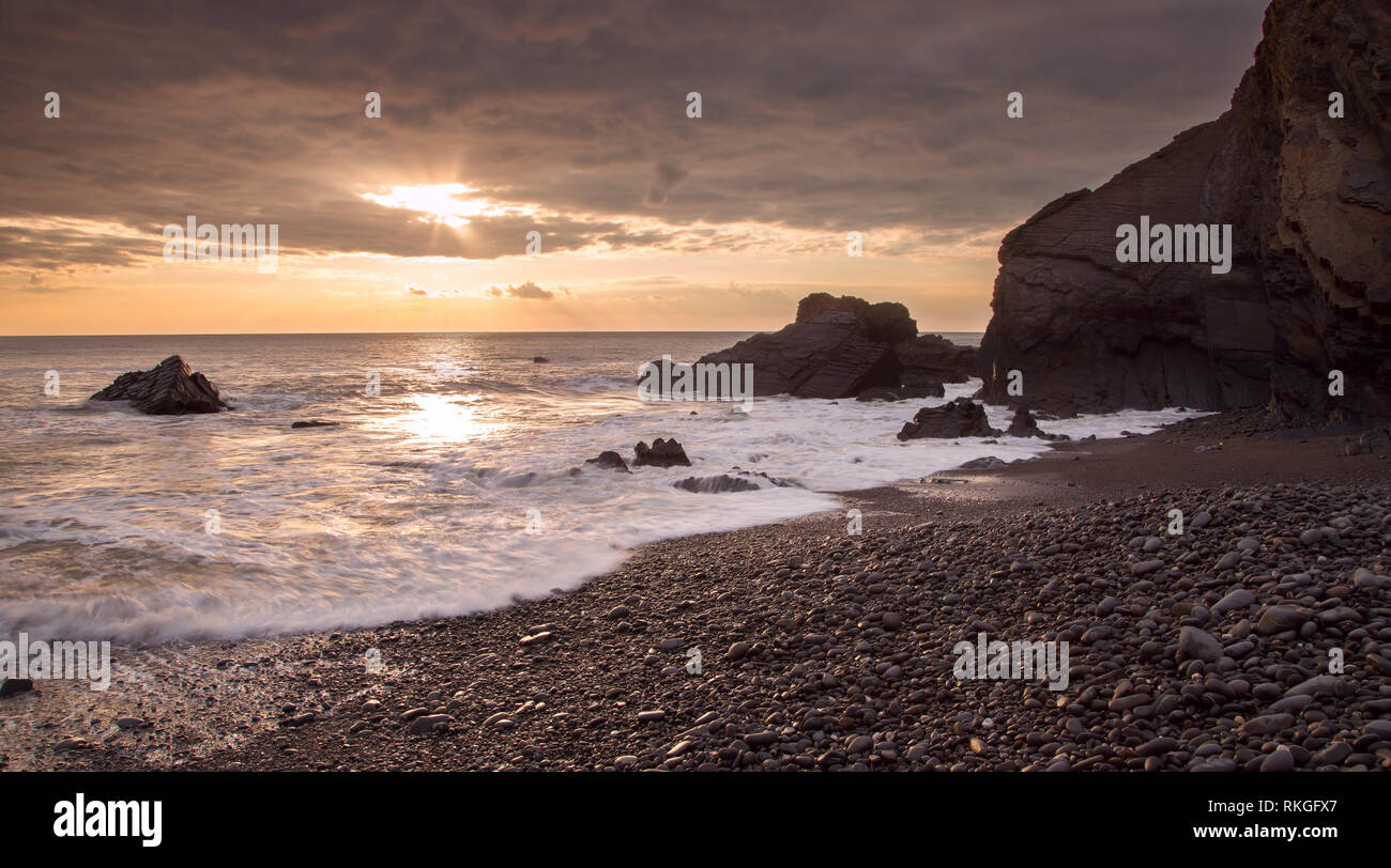 Sunset Sandymouth beach Cornwall uk Stock Photo