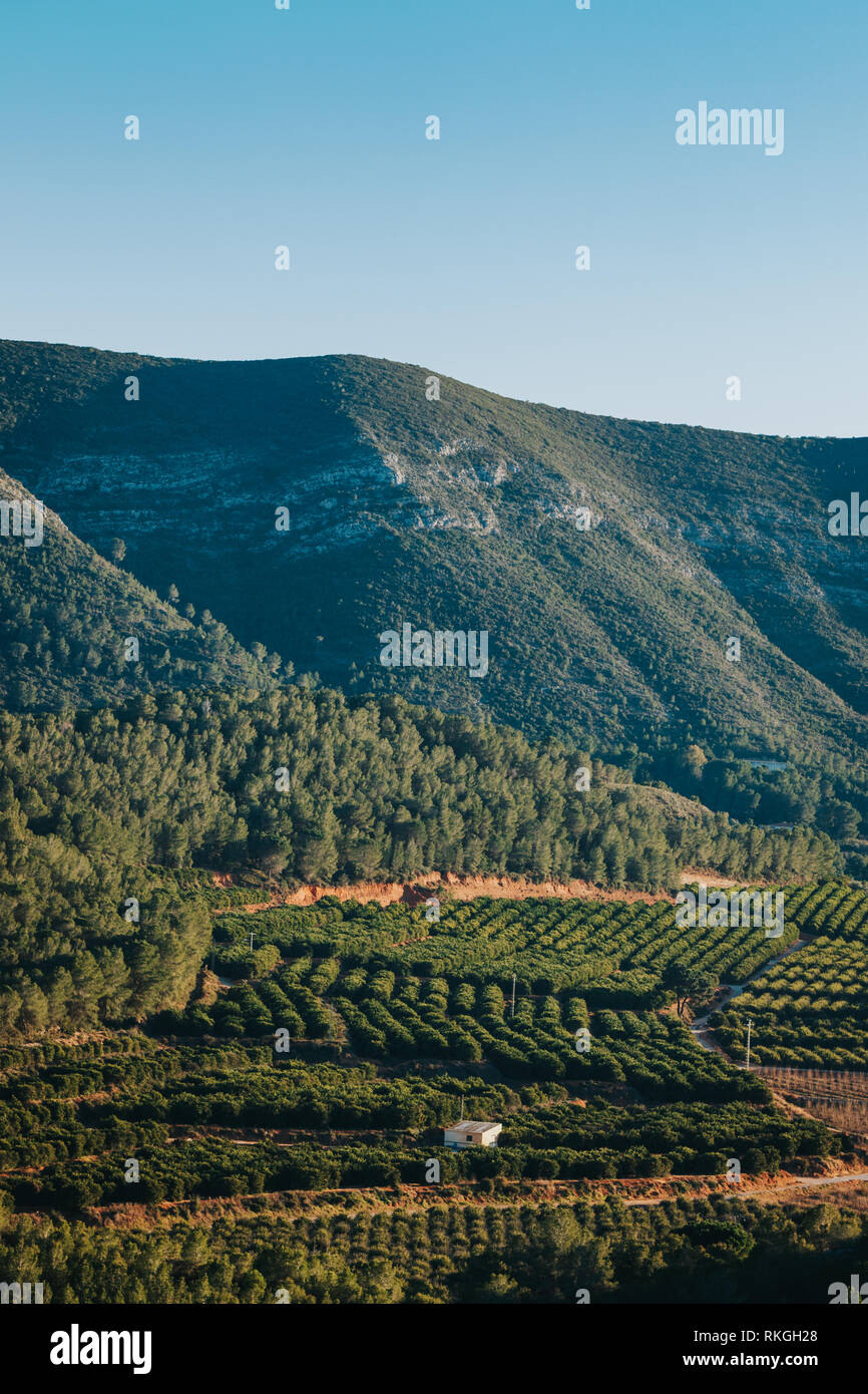 Aerial view of rural Spain aeria with agriculture fields and mountains in background. Stock Photo