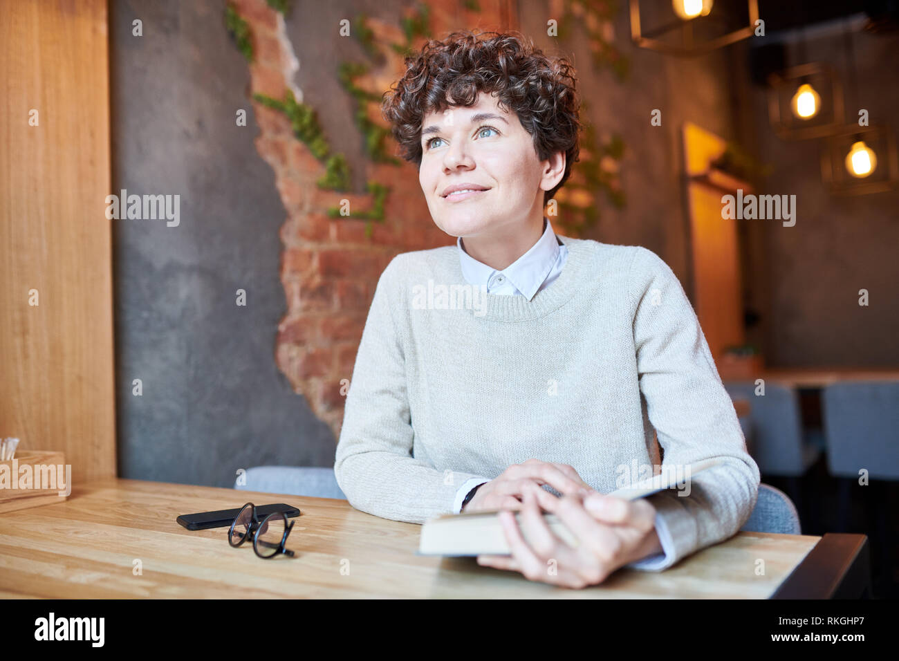 Reading In Cafe Stock Photo Alamy
