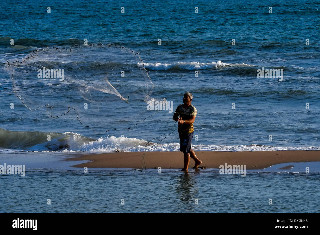 Alpheios, Greece - August 17, 2018: Fisherman casting net during ...