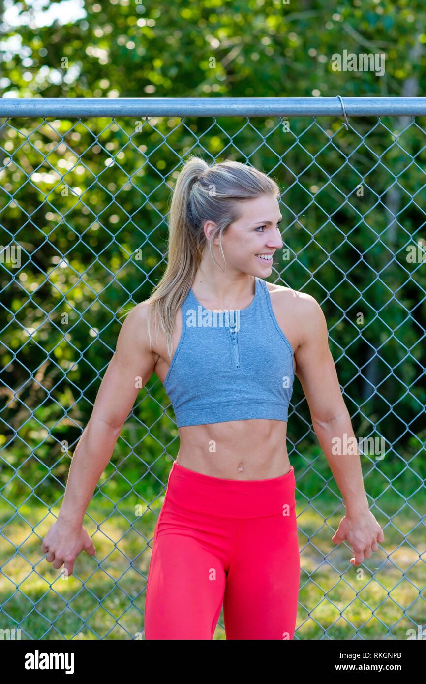 Fashion beauty shot of a young female athlete while working out on an