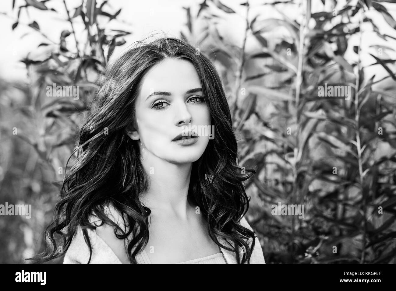 Black and white outdoors portrait of perfect young woman Stock Photo