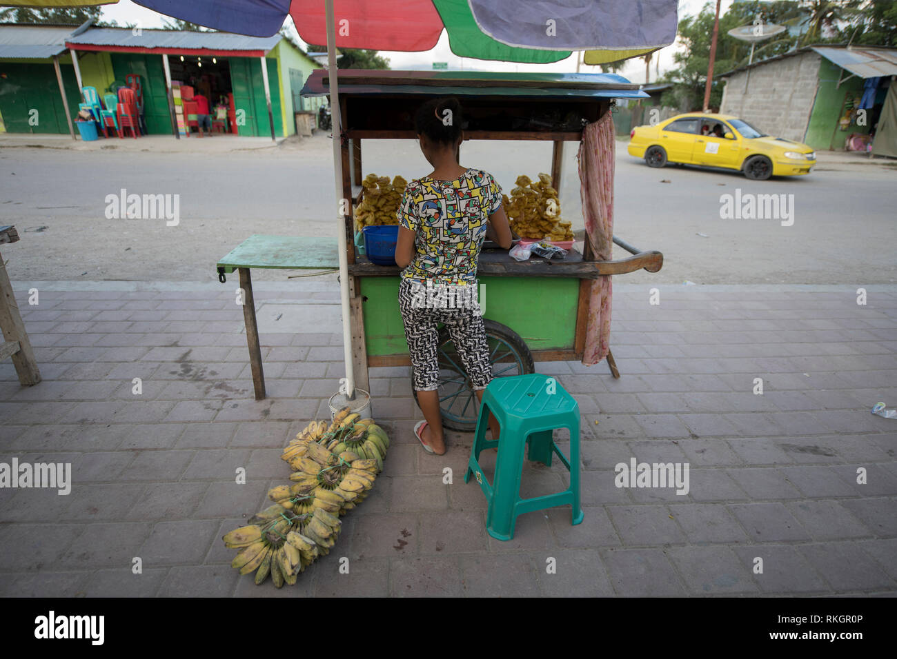 Food seller, Woman selling banana fritter snacks, Dili, East Timor Stock Photo