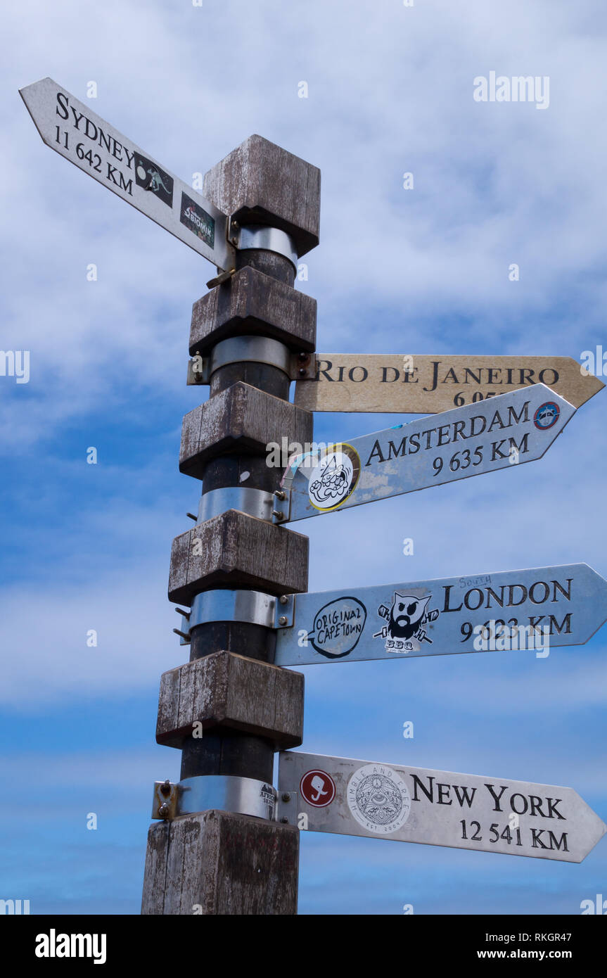 CAPETOWN, SOUTH AFRICA - JANUARY 9, 2019: Direction signpost with various cities including distance from Capetown. Destination concept. Stock Photo