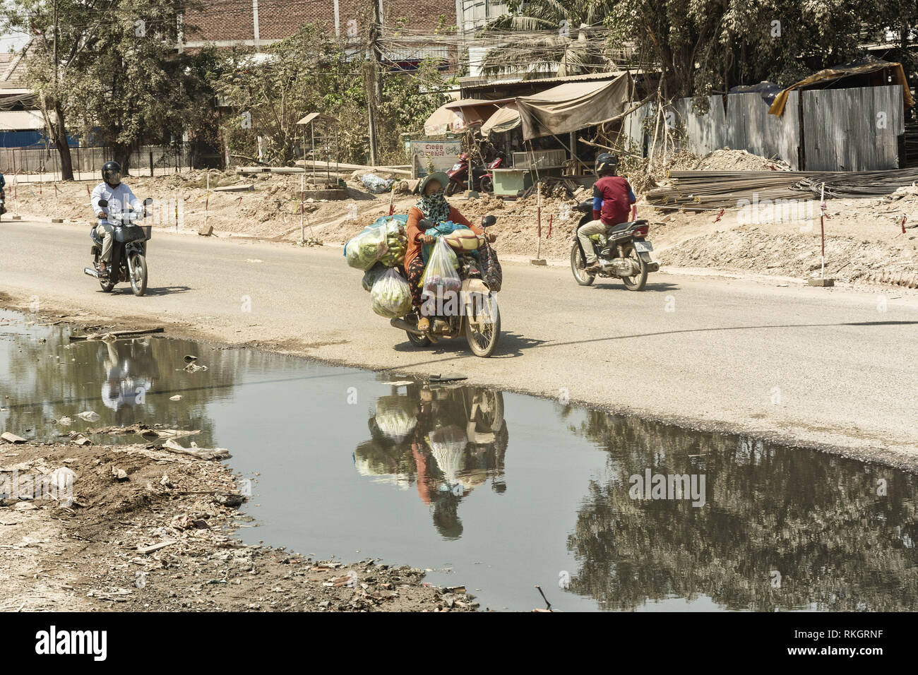 Motorbikes are most important way of transport in Cambodia Stock Photo