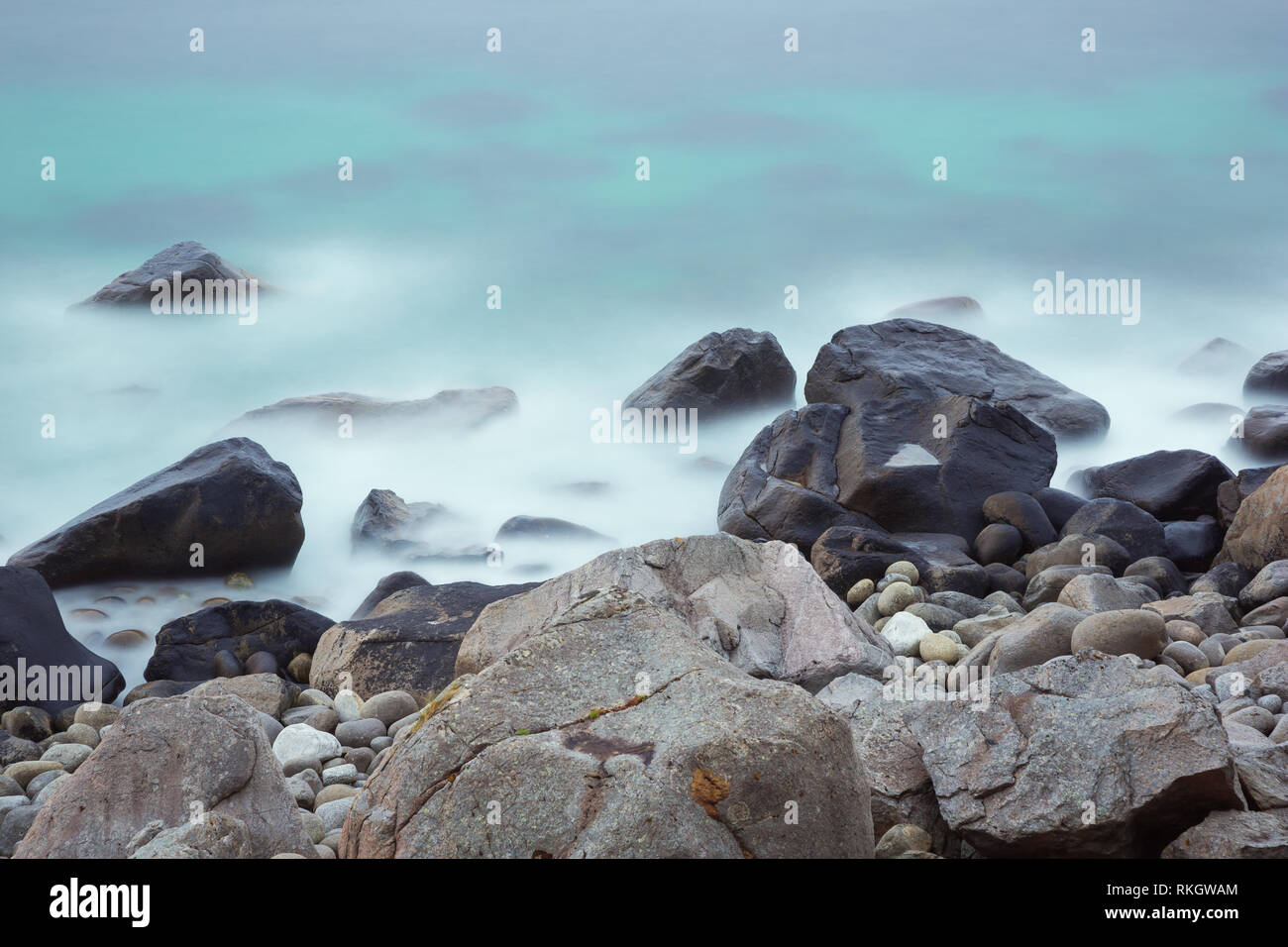 Dreamy view of the boulders on Uttakleiv Beach, a scenic beach near Leknes of the Lofoten Islands Stock Photo