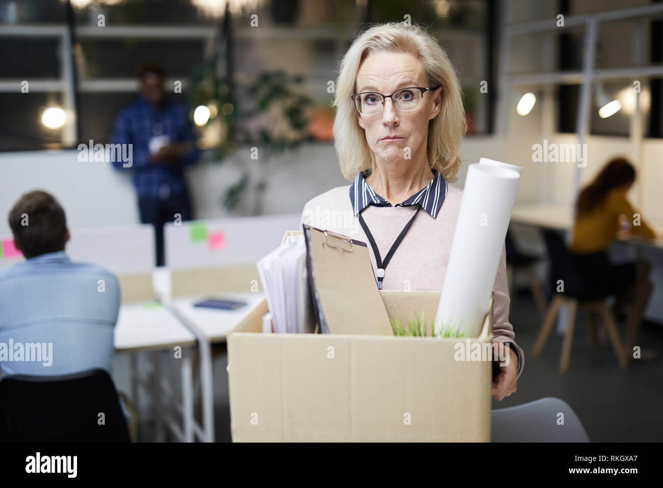 Sad lady dismissed from work Stock Photo