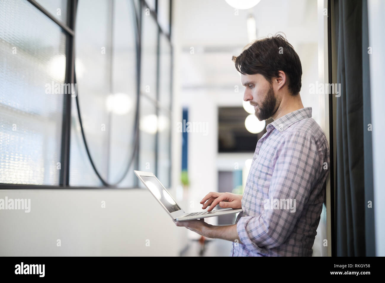 Man focused on online data Stock Photo