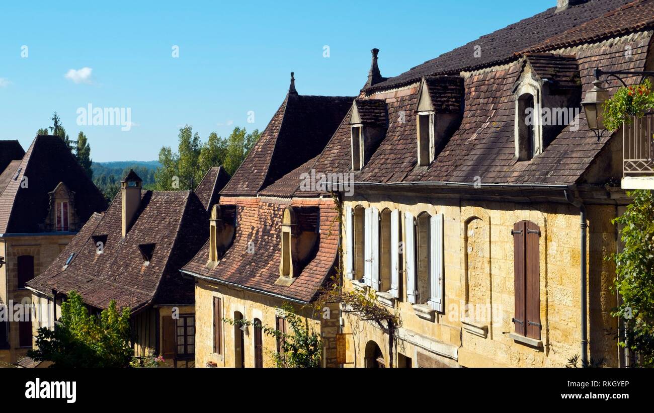 Typically French architecture lines the street in St Cyprien, Dordogne, France. Stock Photo