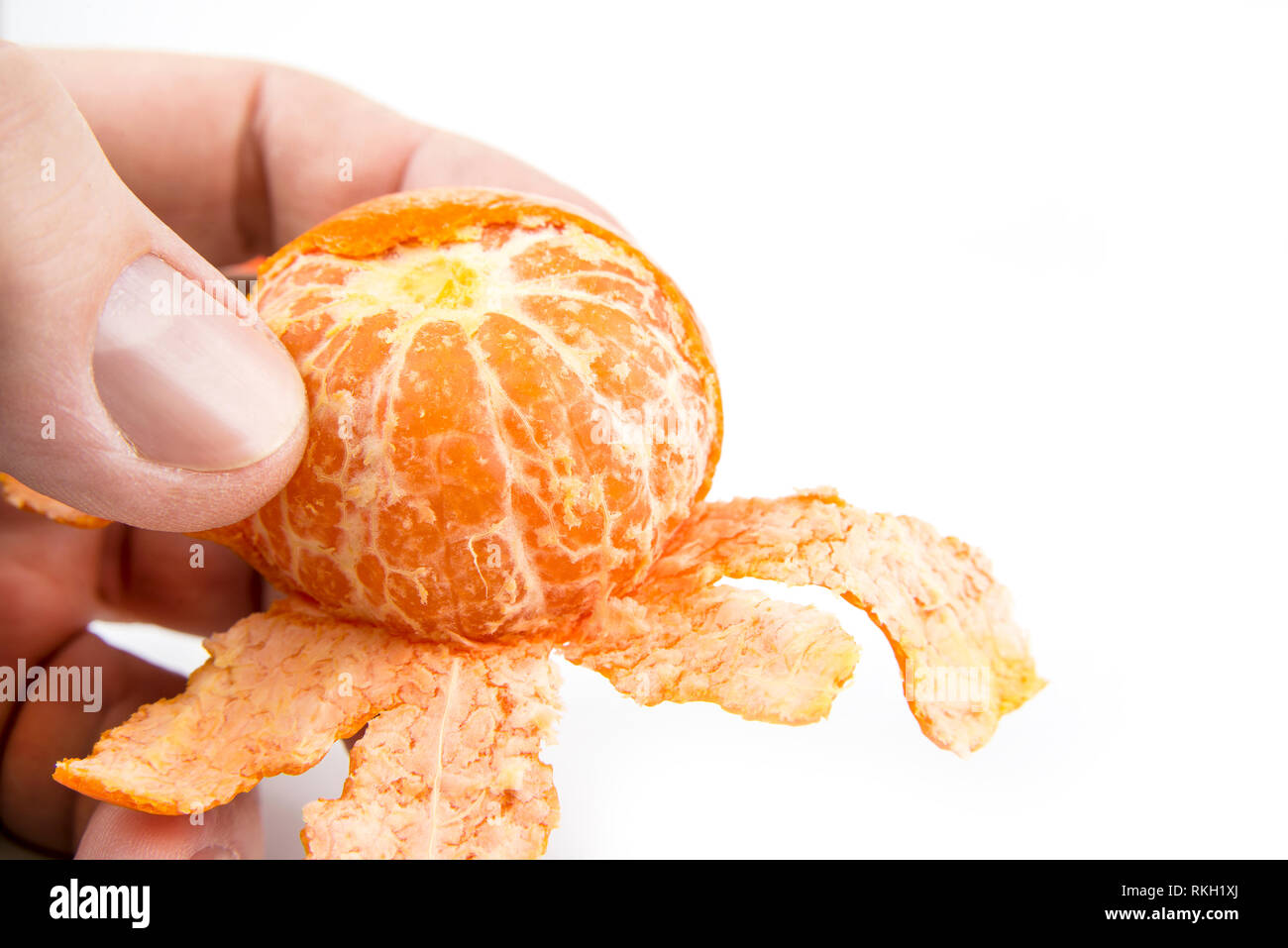 Peel of tangerine by hand on a white background Stock Photo Alamy