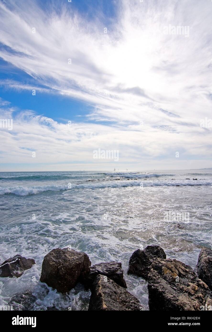 Natural Mediterranean winter seascape with waves and sails on the horizon in Mallorca, Balearic islands, Spain. Stock Photo