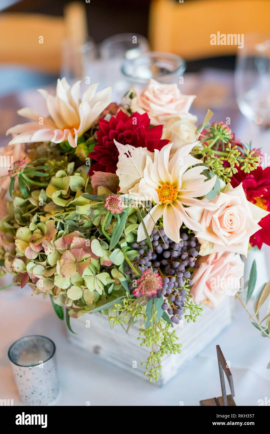 Wedding dinner table reception. Wedding table decoration - white branch  from a tree, crystal pendants, candles in glass spheres, on a white table  with Stock Photo - Alamy