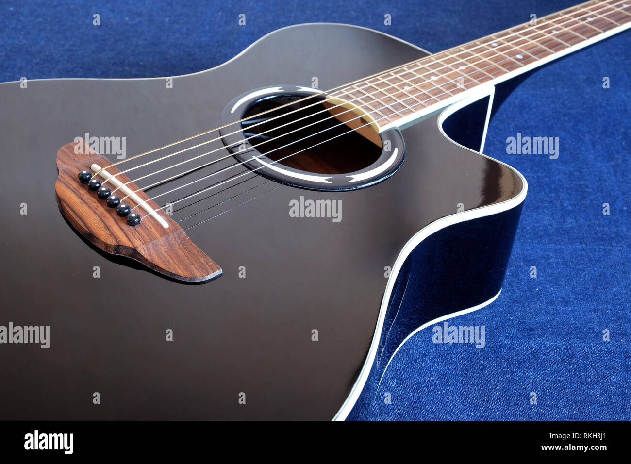 Classic acoustic six strings guitar black color top with cutaway