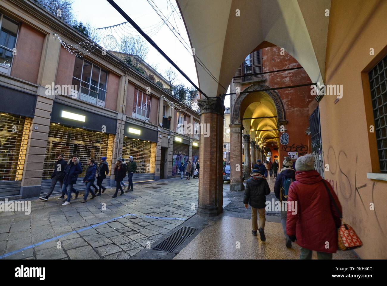 Bologna, Emilia Romagna, Italy. December 2018. The long porticos characterize the city, the Christmas atmosphere attracts people who strolls visiting  Stock Photo