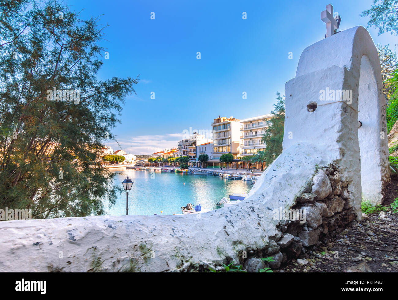 The lake Voulismeni in Agios Nikolaos,  a picturesque coastal town with colorful buildings around the port in the island Crete, Greece. Stock Photo