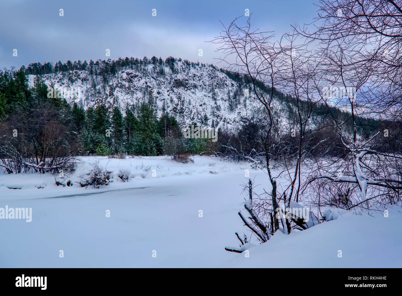 Winter landscape the river in the forest at sunset Stock Photo - Alamy