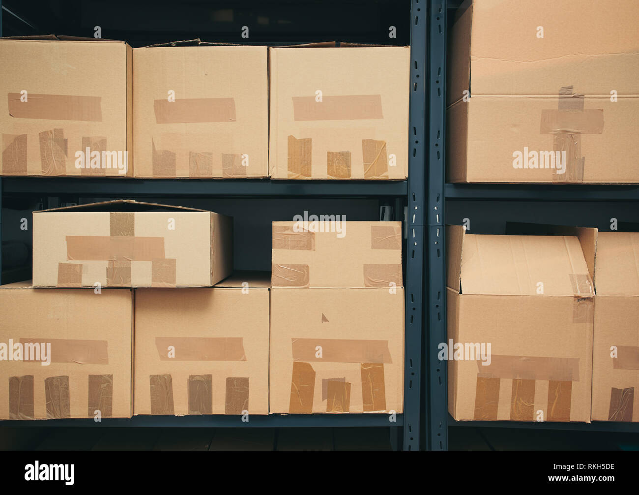 Cardboard boxes on shelves Stock Photo Alamy