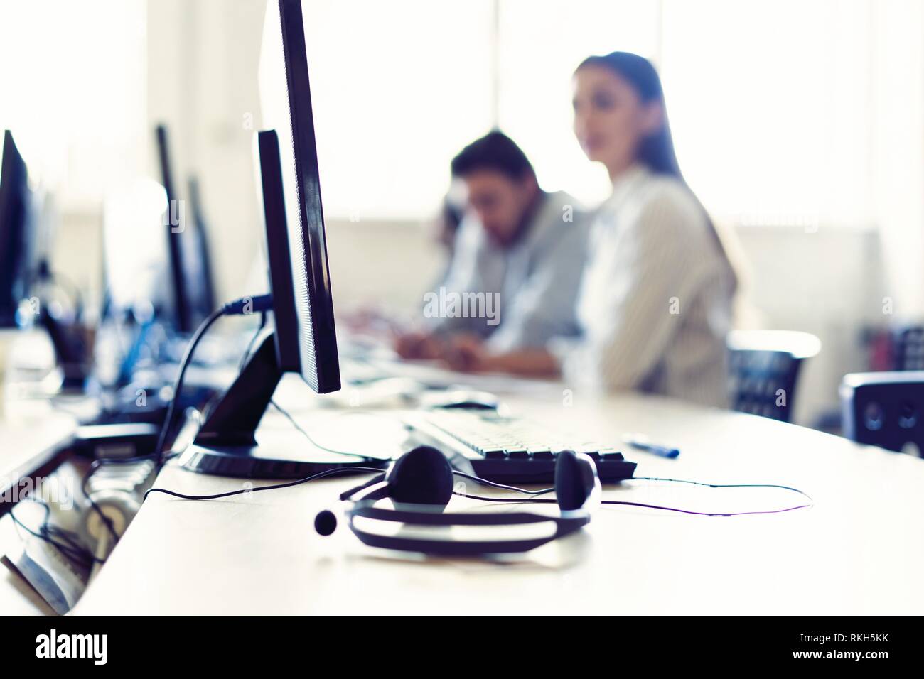 We are waiting for your call. Call center workers are working at modern