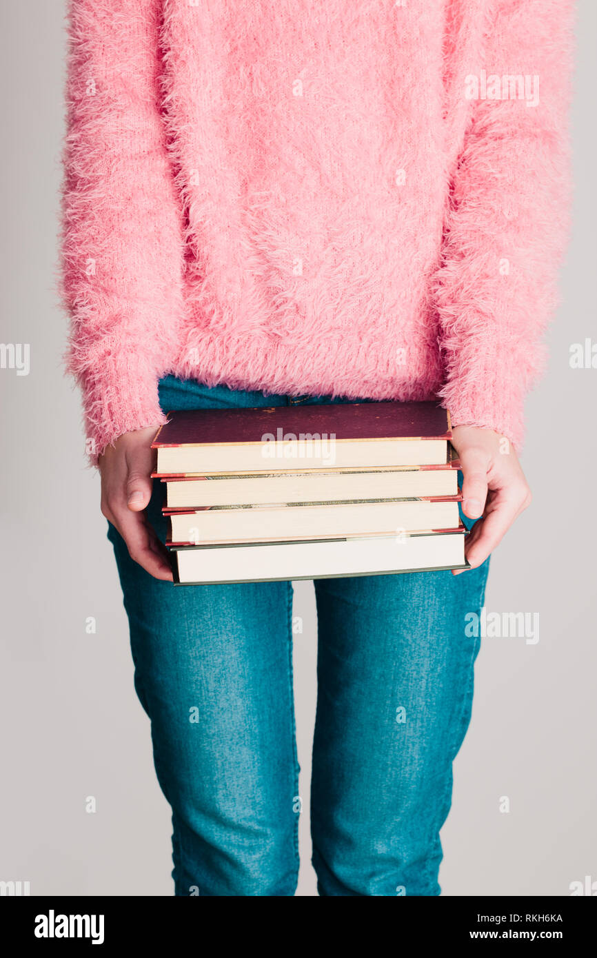 pink sweater with blue jeans
