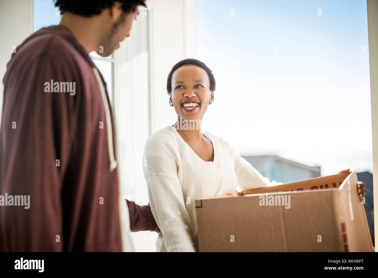 Happy couple moving into their new home. Stock Photo