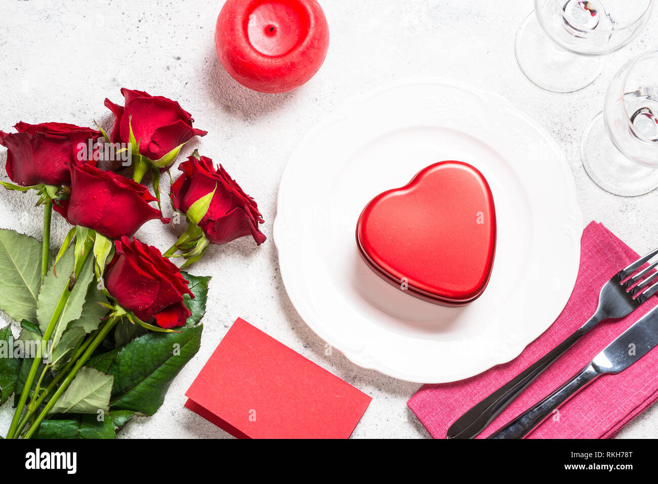 Valentines day table setting with plate, roses and present Stock Photo ...