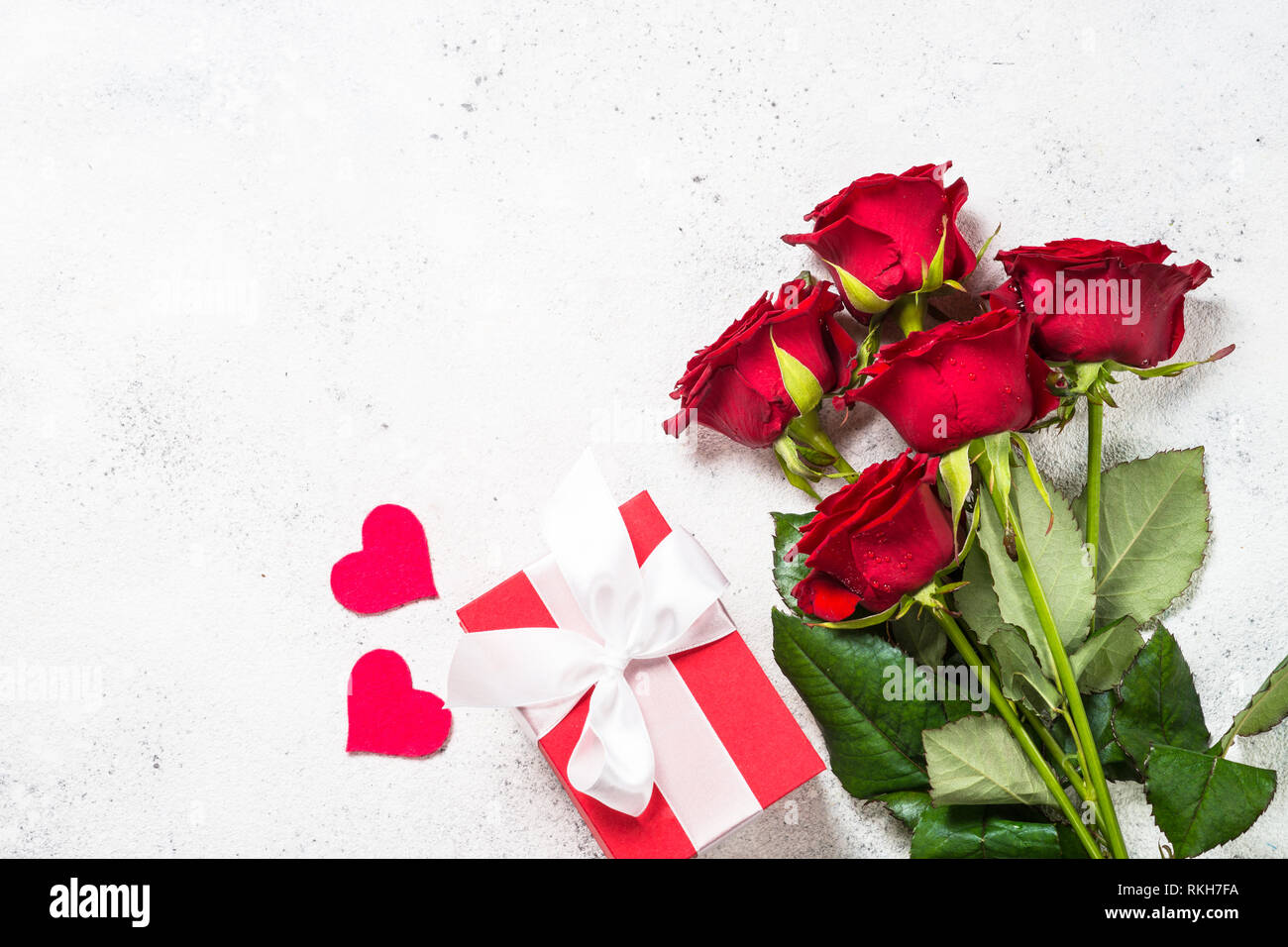 Valentines day background. Red roses, hearts and present on white Stock ...