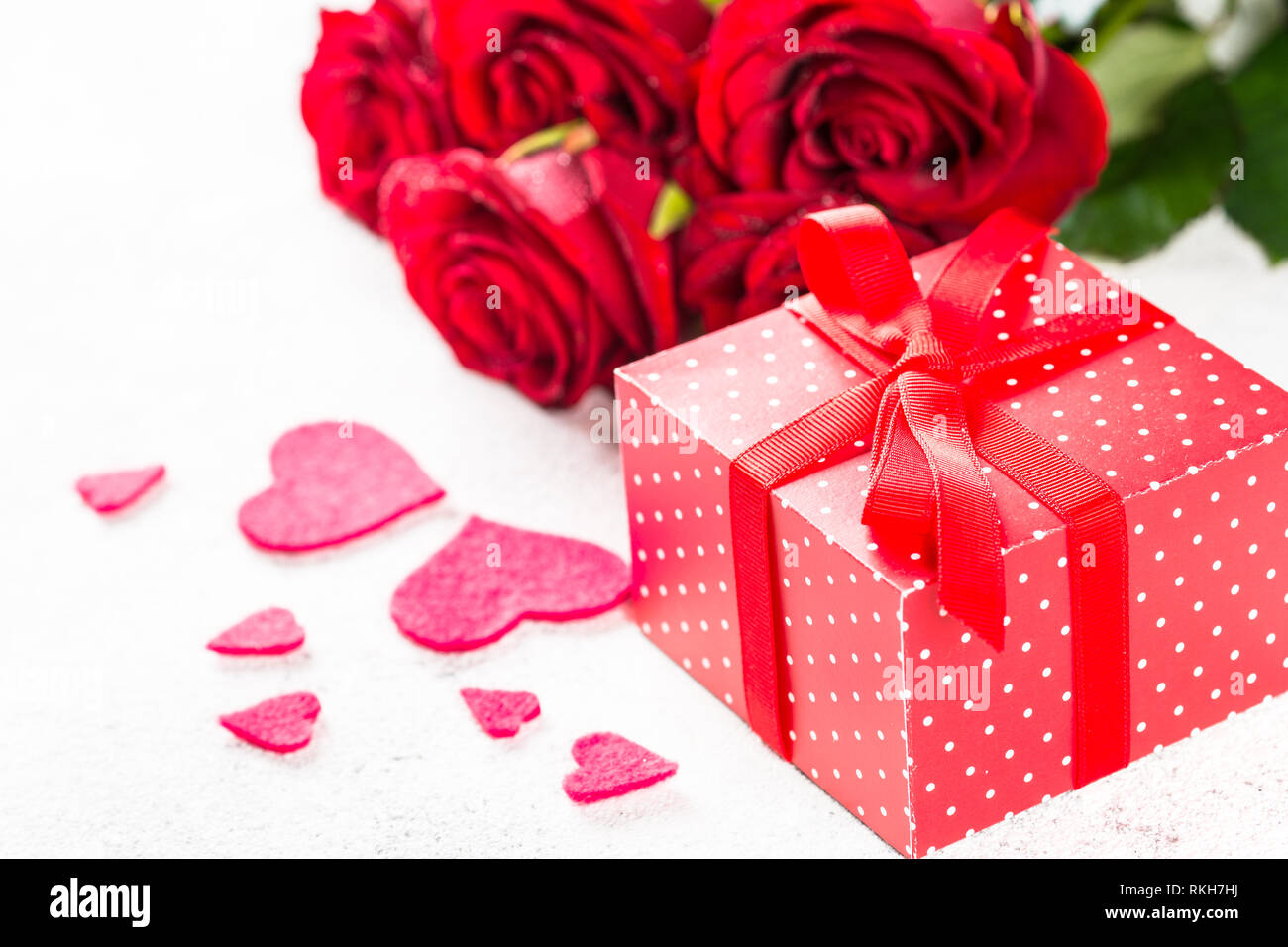 Valentines day background. Red roses, hearts and present on white Stock ...