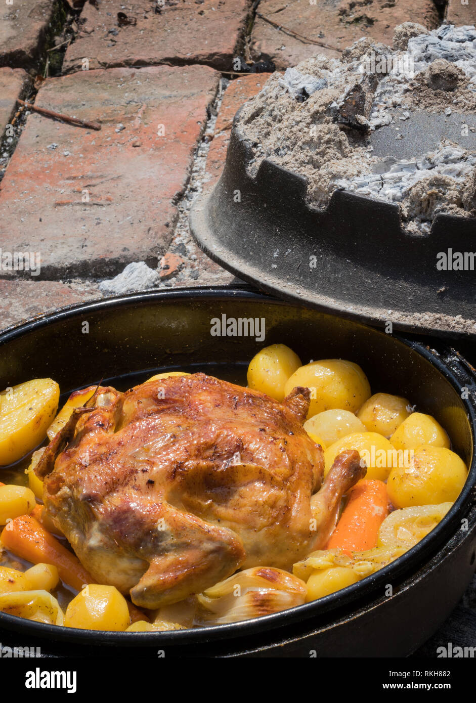 Cooking of traditional Croatian meal Peka in metal pots called sac sach
