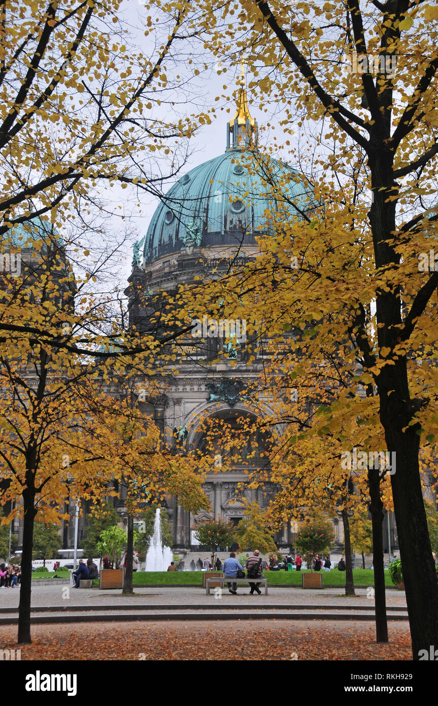 Around Berlin - A view of the Berliner Dom - Berlin Cathedral through an avenue of trees in Autumn. Stock Photo