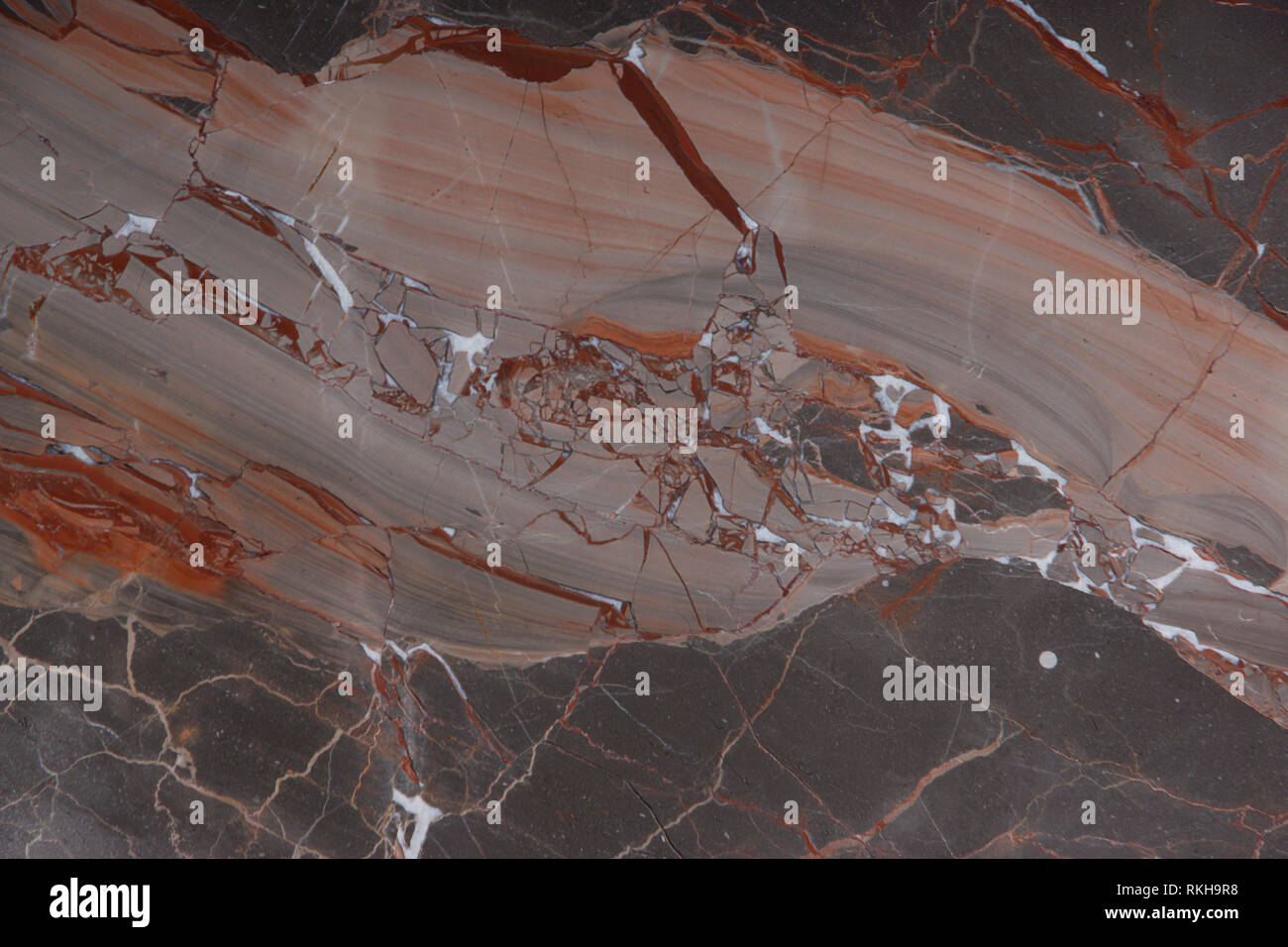 Marble Slab brown with pink and red veins, called Caravaggio, natural stone, marble texture. Stock Photo
