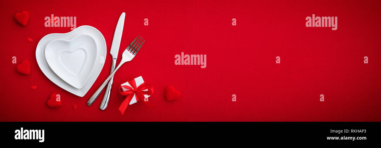 Romantic Setting Table - Cutlery And Plates On Red Table Stock Photo