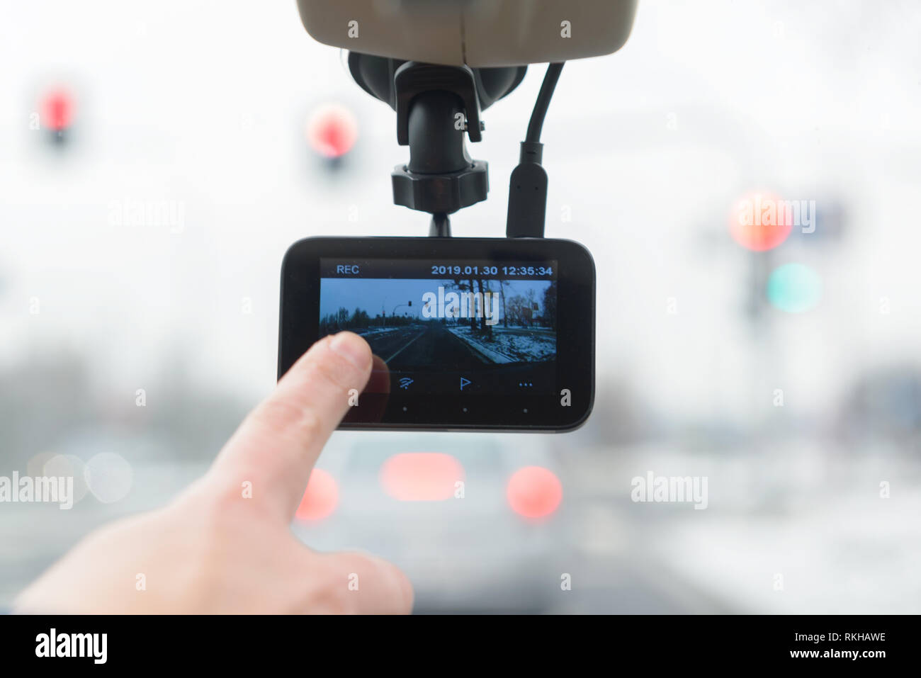 Using dashboard camera to continuously record a view through a vehicle