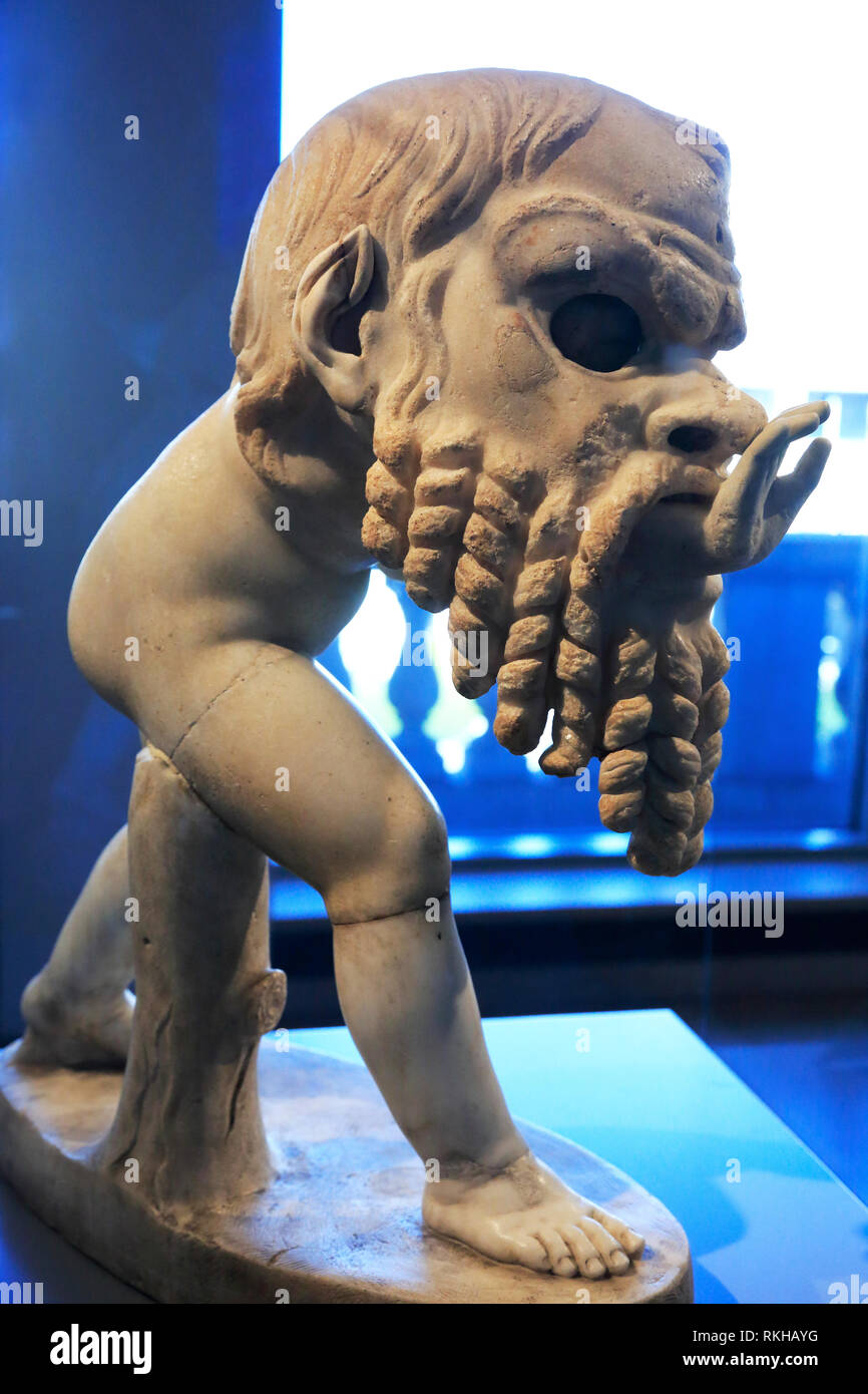 Ancient statue of a Young Satyr Wearing a Theater Mask of Silenos display in Art institute of Chicago.Illinois.USA Stock Photo