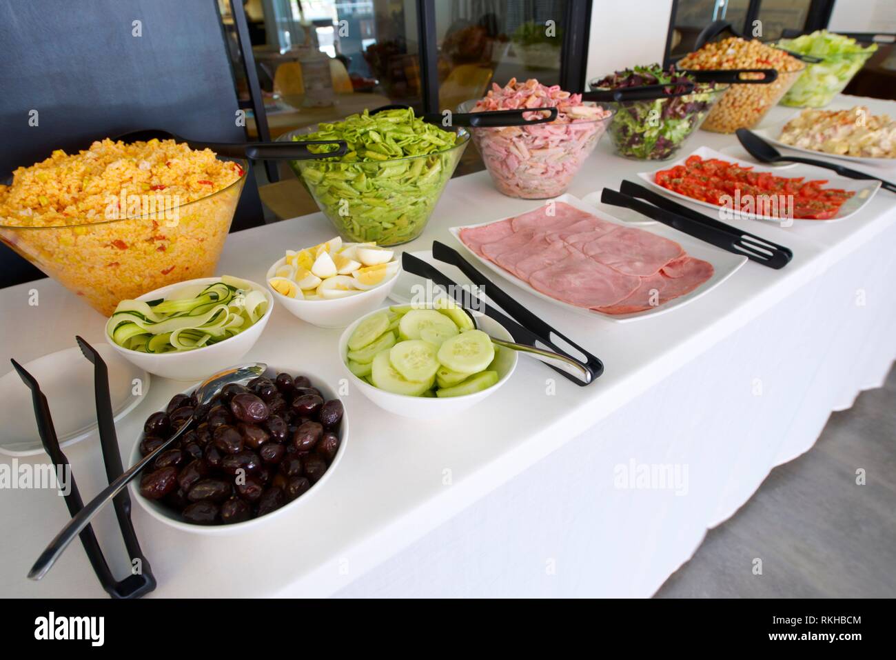Dishes of assorted food for salad buffet in a restaurant Stock