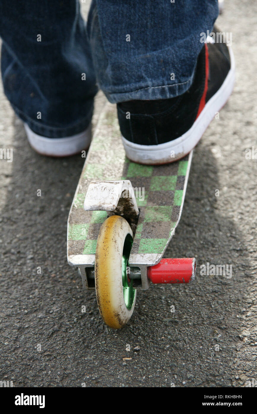 A view of a well worn scooter used for stunt riding. Often seen at skate parks. Stock Photo