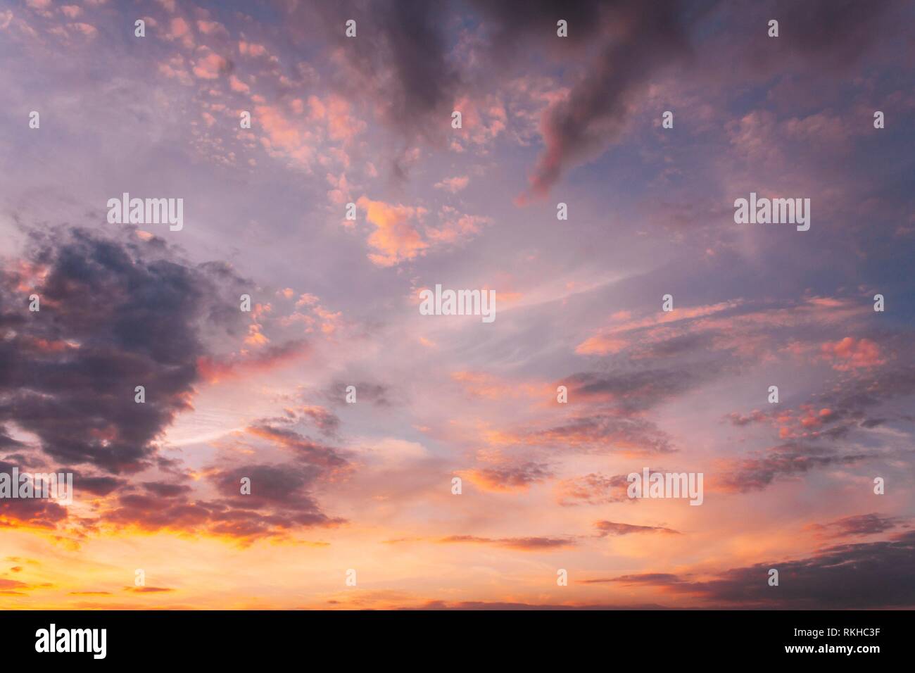Sunset Sunrise Sky Background. Natural Bright Dramatic Sky In Sunset Dawn Sunrise. Yellow, Magenta, Purple And Pink Colors. Stock Photo