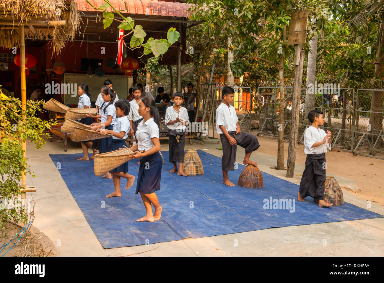 Cambodan school children wearing school uniform, perform traditional dance for tourists at Siem Reap, Cambodia, Asia Stock Photo