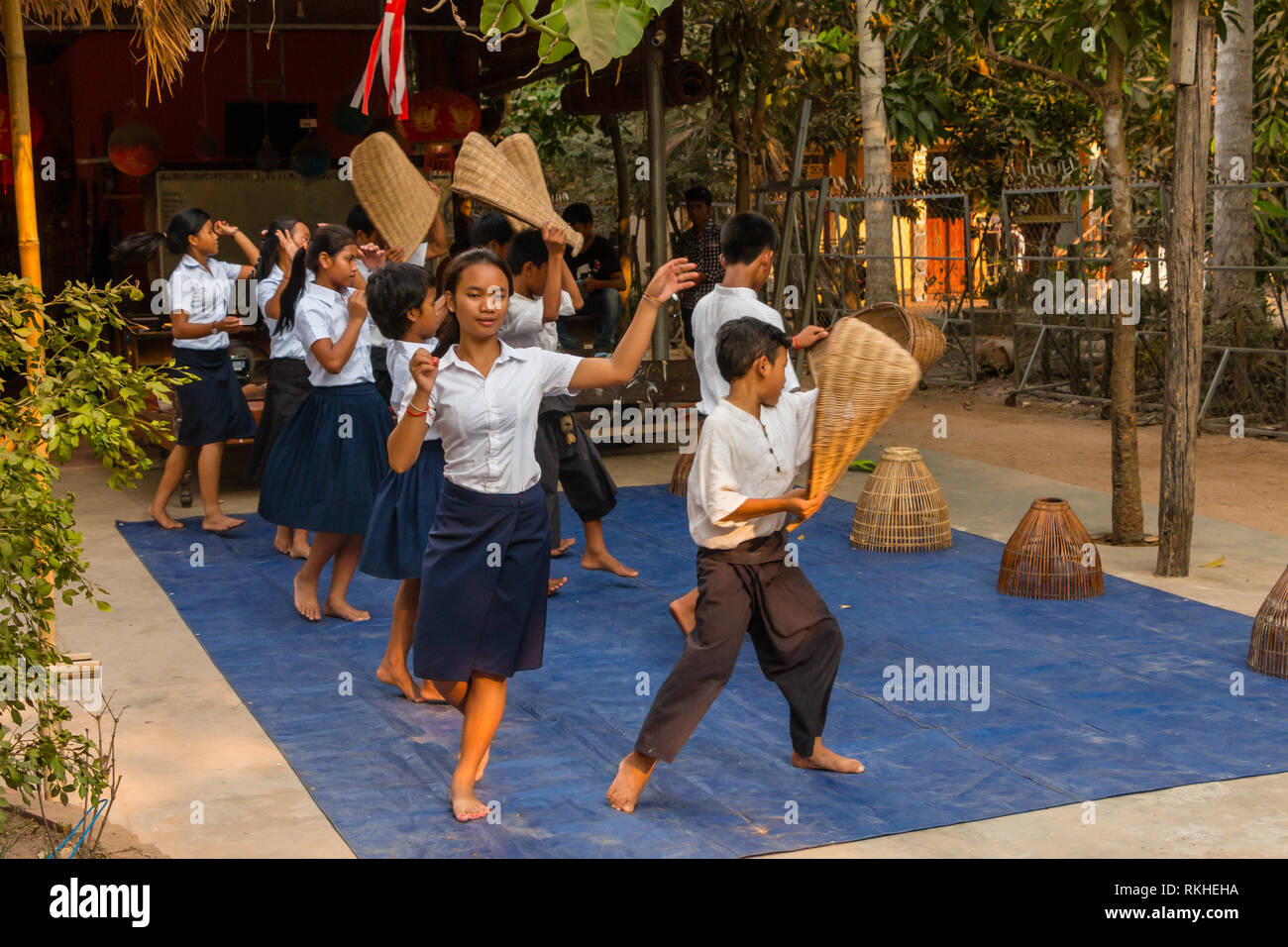 Cambodan school children wearing school uniform, perform traditional dance for tourists at Siem Reap, Cambodia, Asia Stock Photo
