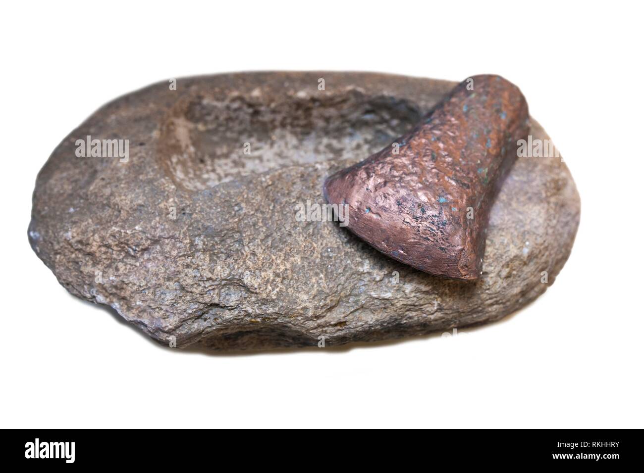 Stone carved axe-head mould and copper piece. Early Bronze Age techique replica. Stock Photo