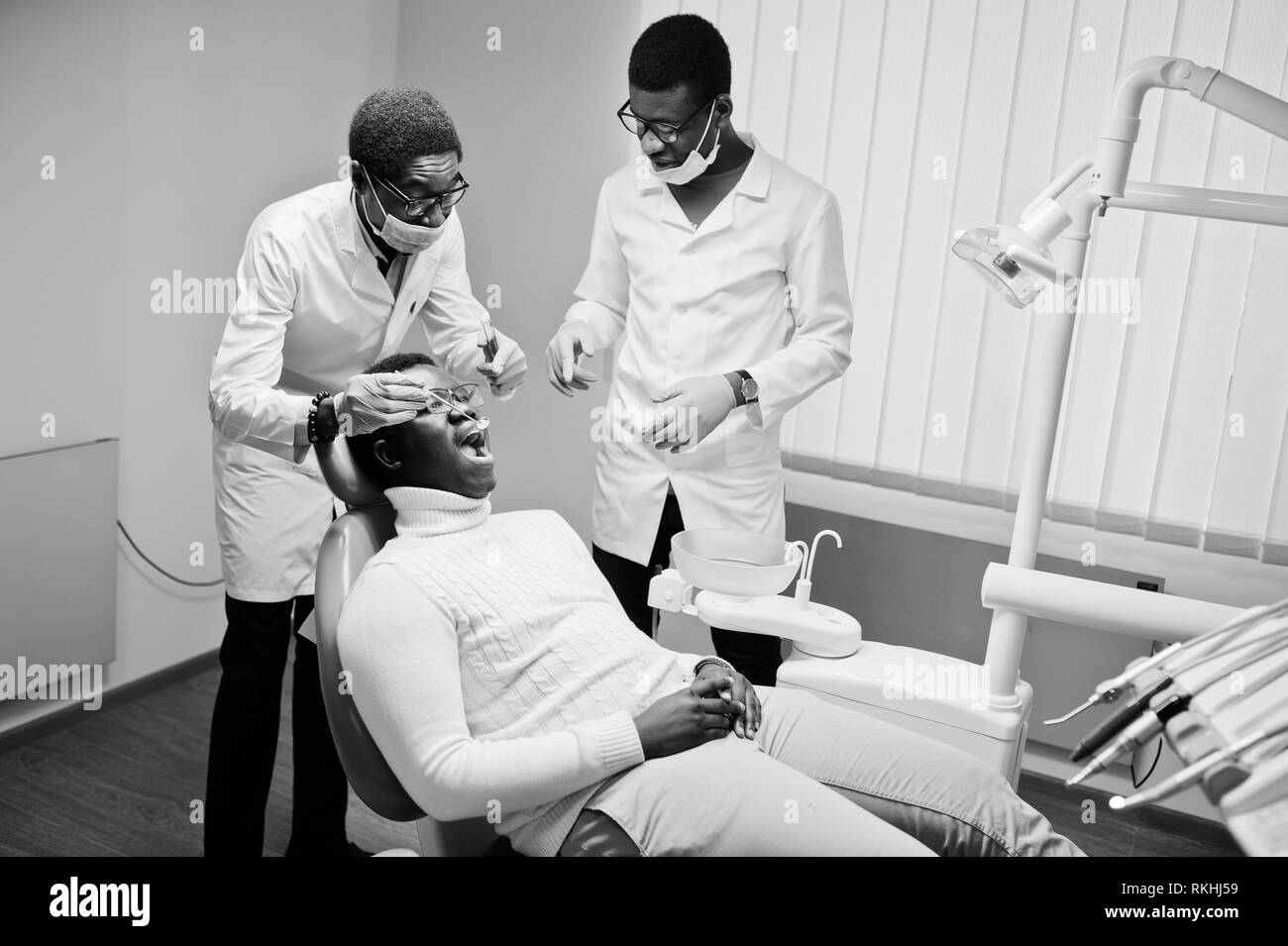 Young man in dentist chair Black and White Stock Photos & Images Alamy