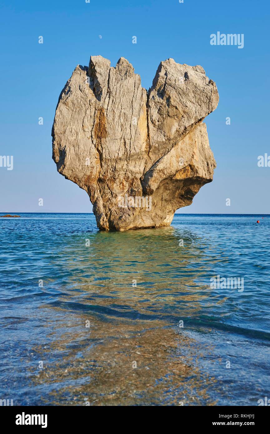 Striking rock, rock formation in water, Preveli beach, Crete, Greece Stock Photo