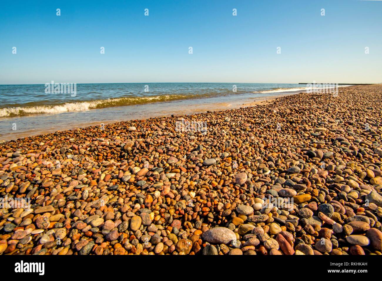 lonesome beach of the Baltic Sea with blue sky in Poland Stock Photo