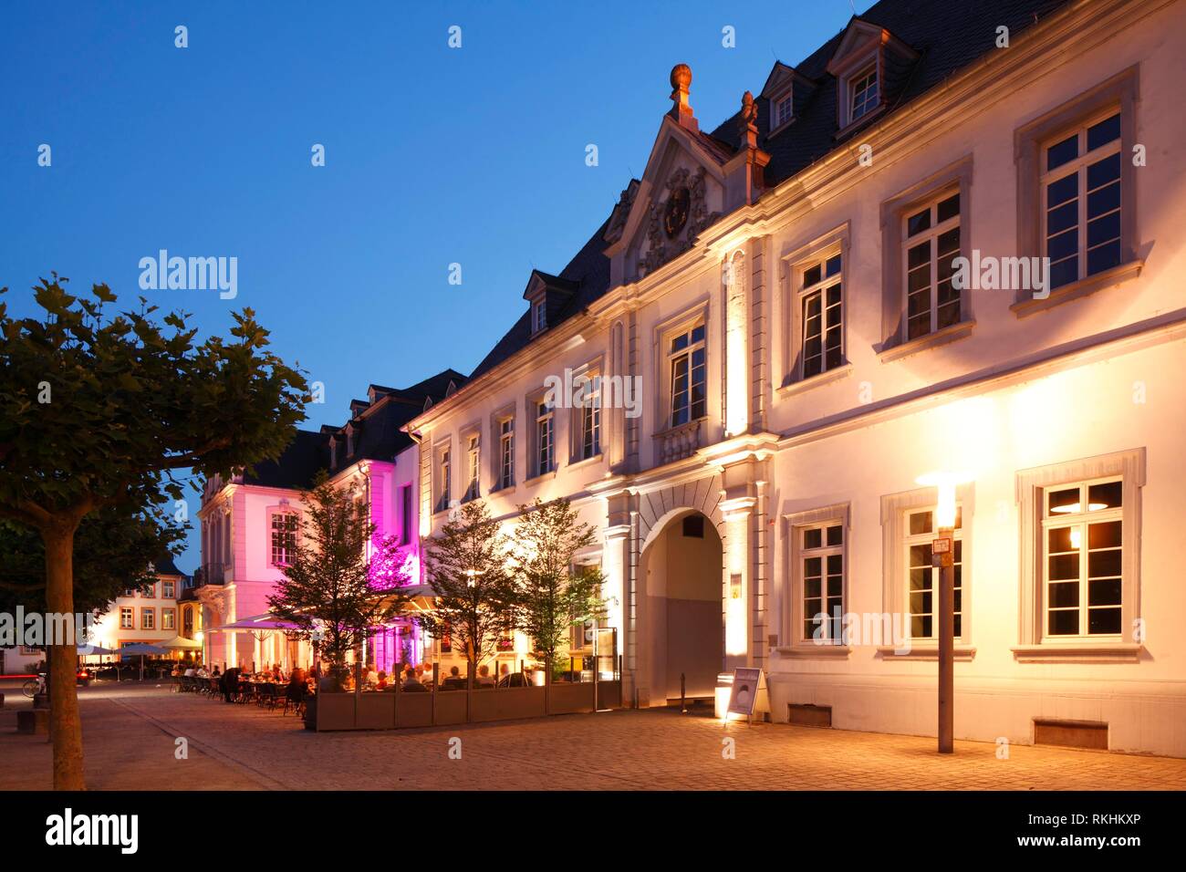 Historical Palais Walderdorff at the Domfreihof at dusk, Trier, Rhineland-Palatinate, Germany Stock Photo