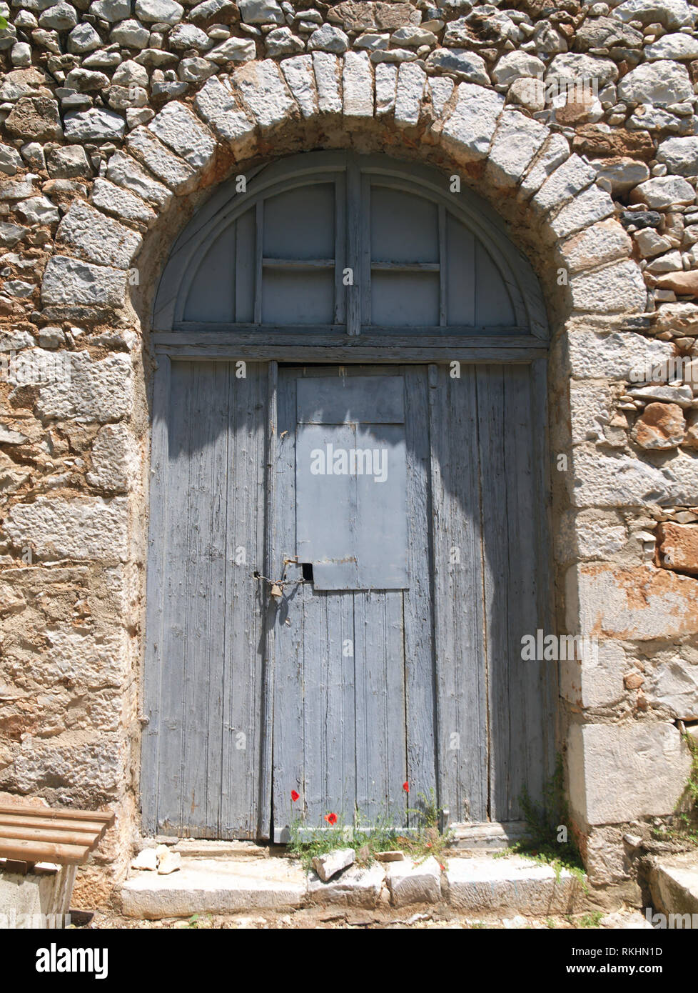 Old stone house wooden door Stock Photo - Alamy