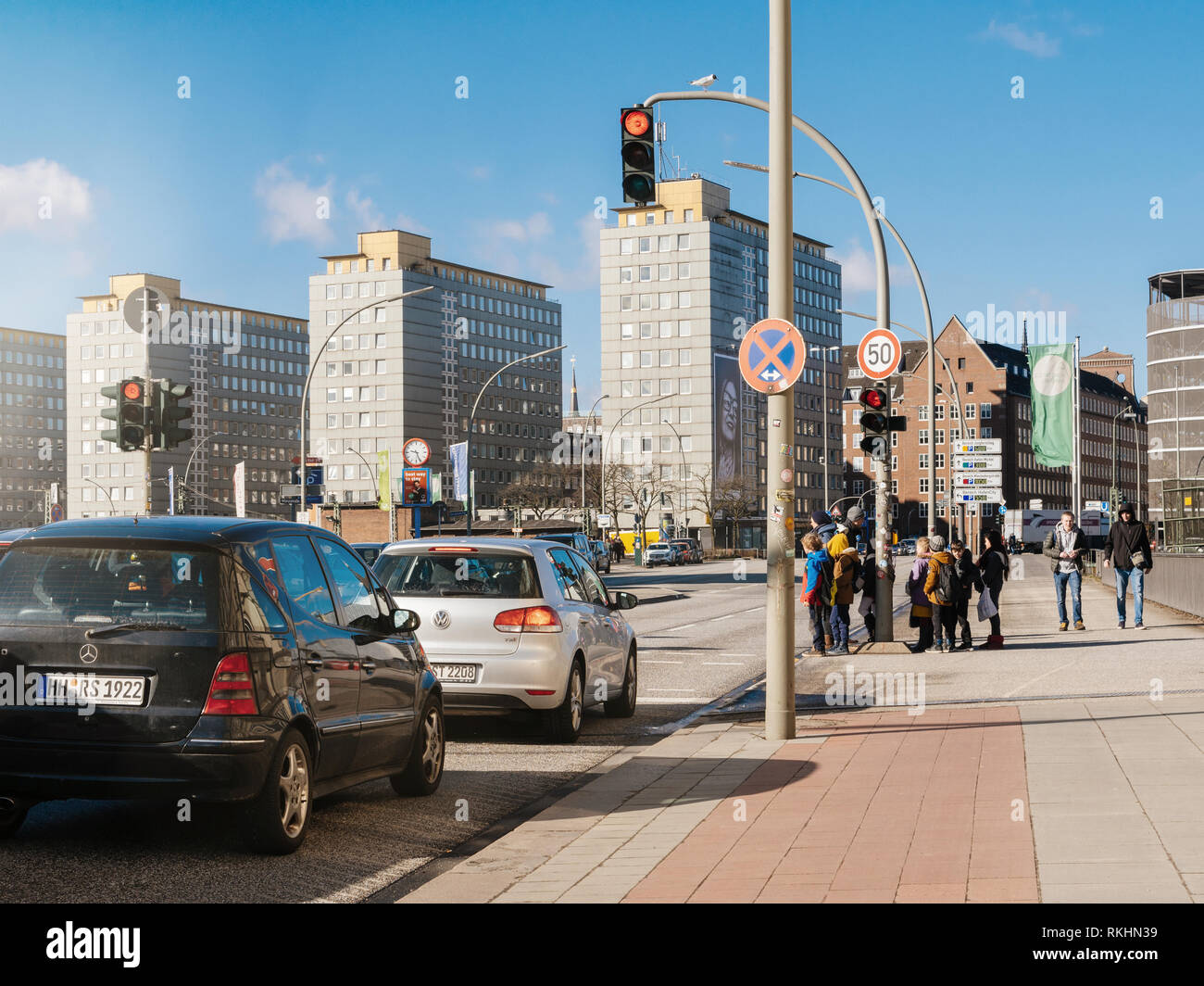 HAMBURG, GERMANY MAR 20, 2018 Kids waiting to cross the street in