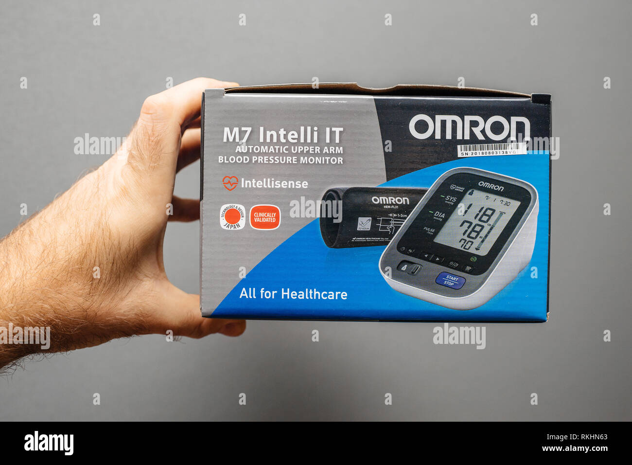 https://c8.alamy.com/comp/RKHN63/paris-france-dec-28-2018-man-pov-at-cardboard-box-of-omron-m7-intelli-it-automatic-upper-arm-blood-pressure-monitor-against-gray-background-RKHN63.jpg
