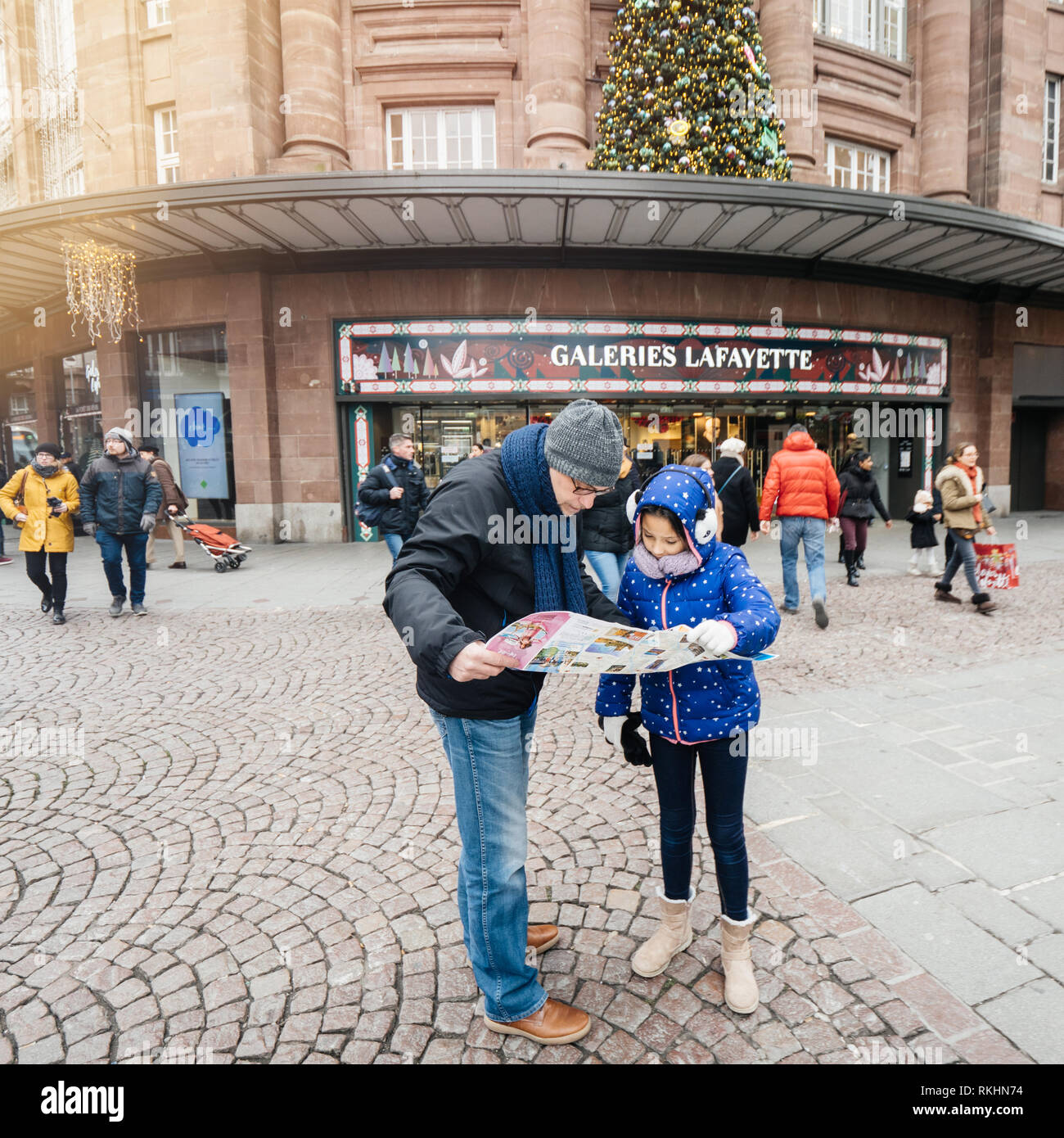Strasbourg, France - Dec 29, 2018: Tourists, father and daughter