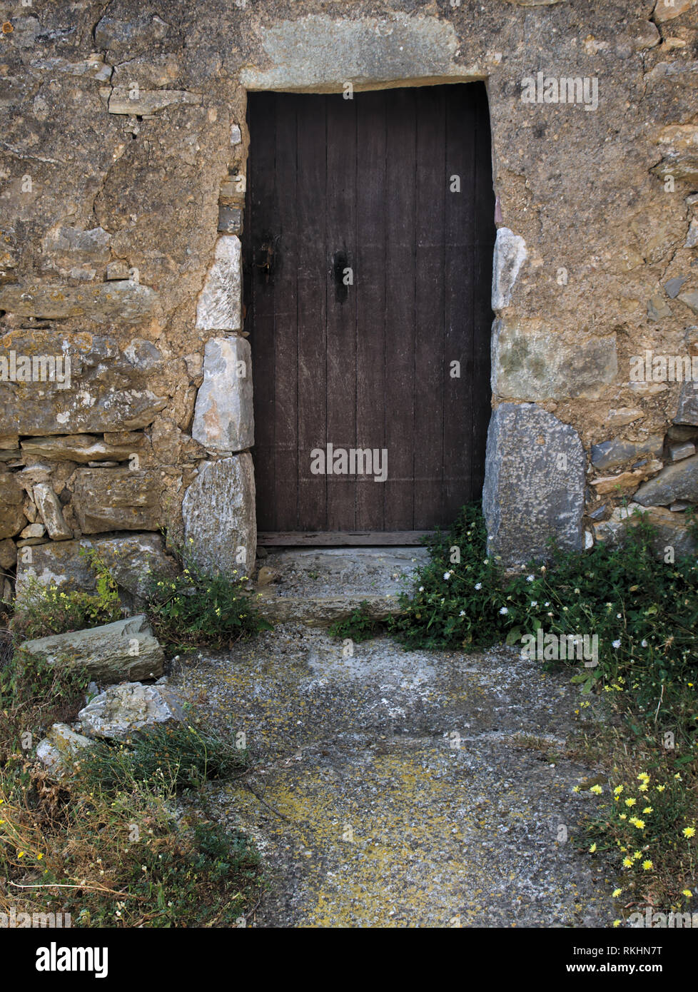 Old stone house wooden door Stock Photo - Alamy