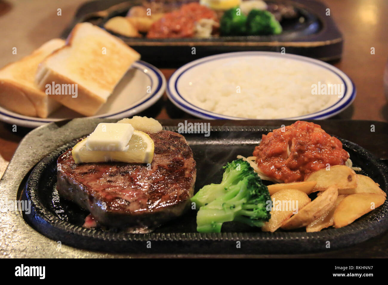 grilled beef sirloin steak with side dishes Stock Photo Alamy